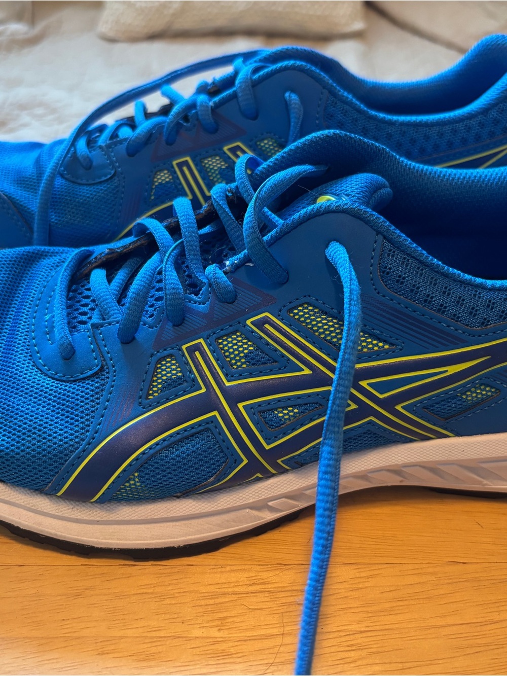 Asics Blue Running Shoes with Yellow Accents